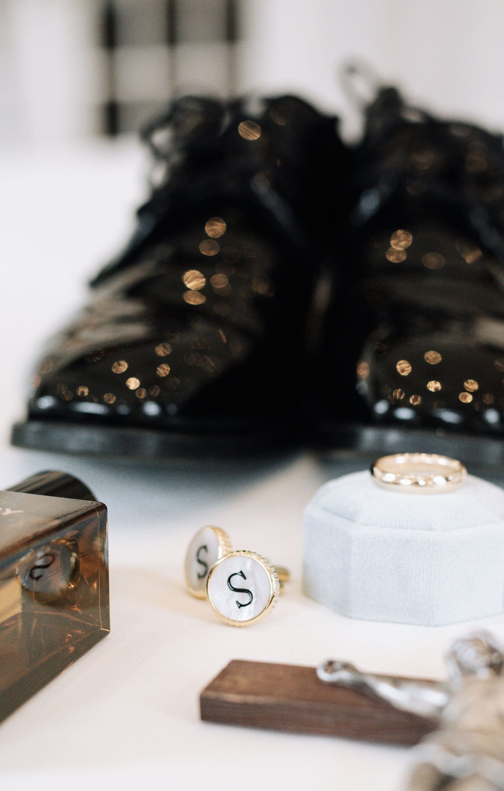 Catholic groom's details featuring cuff links with last name's initial 