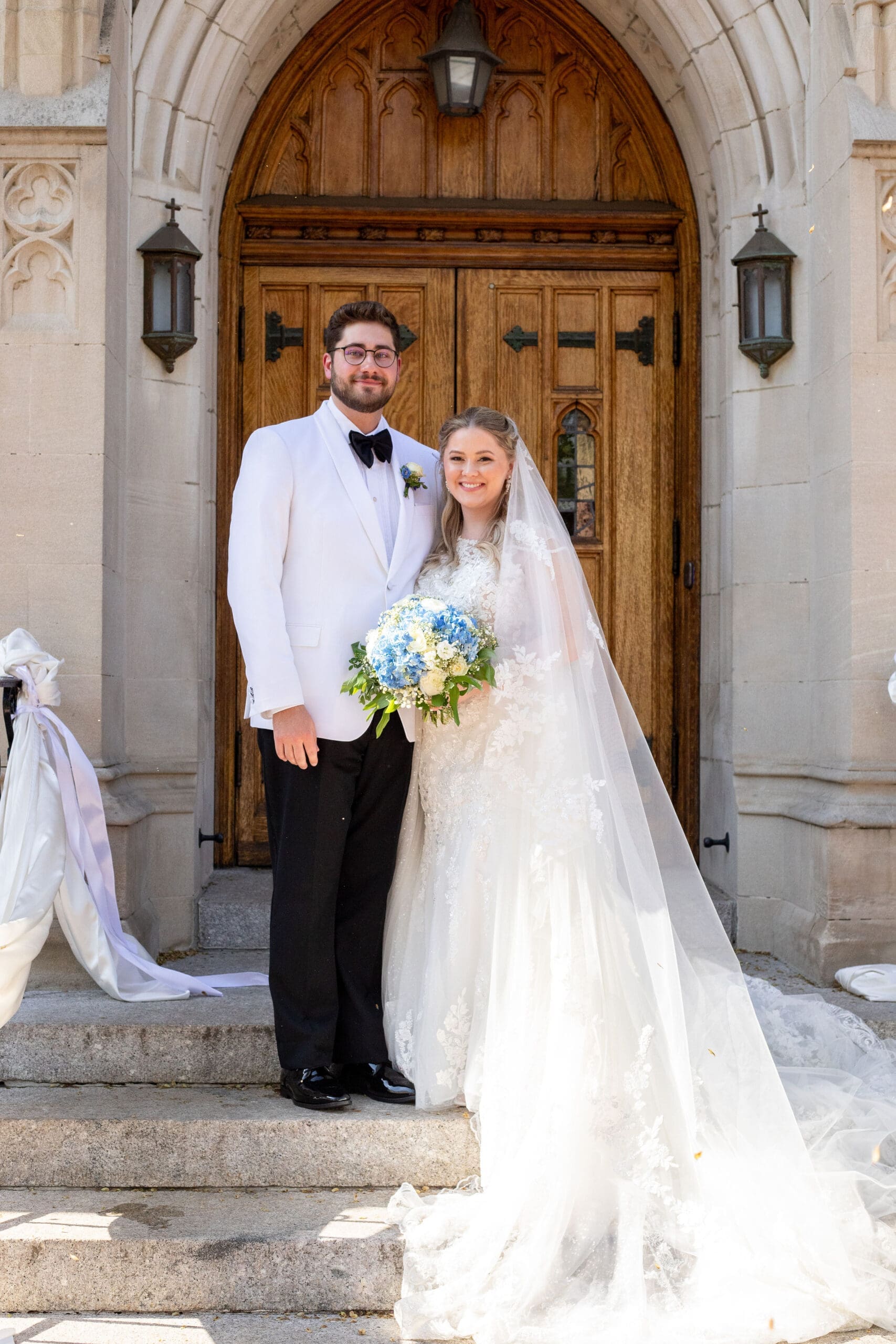 Bridal portrait of bride and groom outside of their Catholic Church 