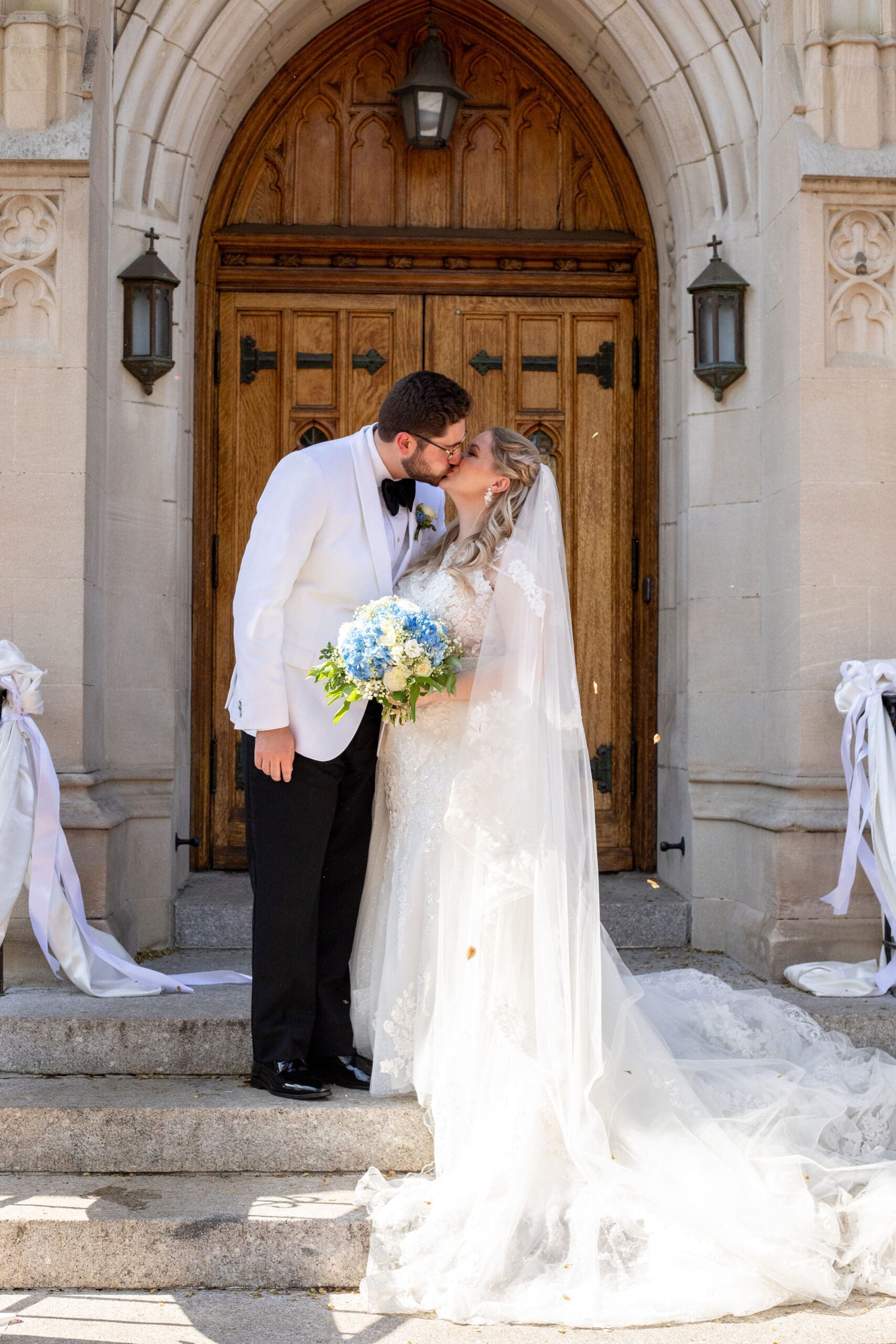 Catholic Bride and Groom kissing after wedding ceremony